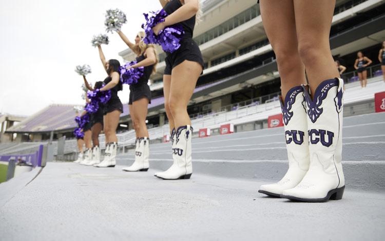 The Texas Christian University Show Girls Pose with their Justin Boots.